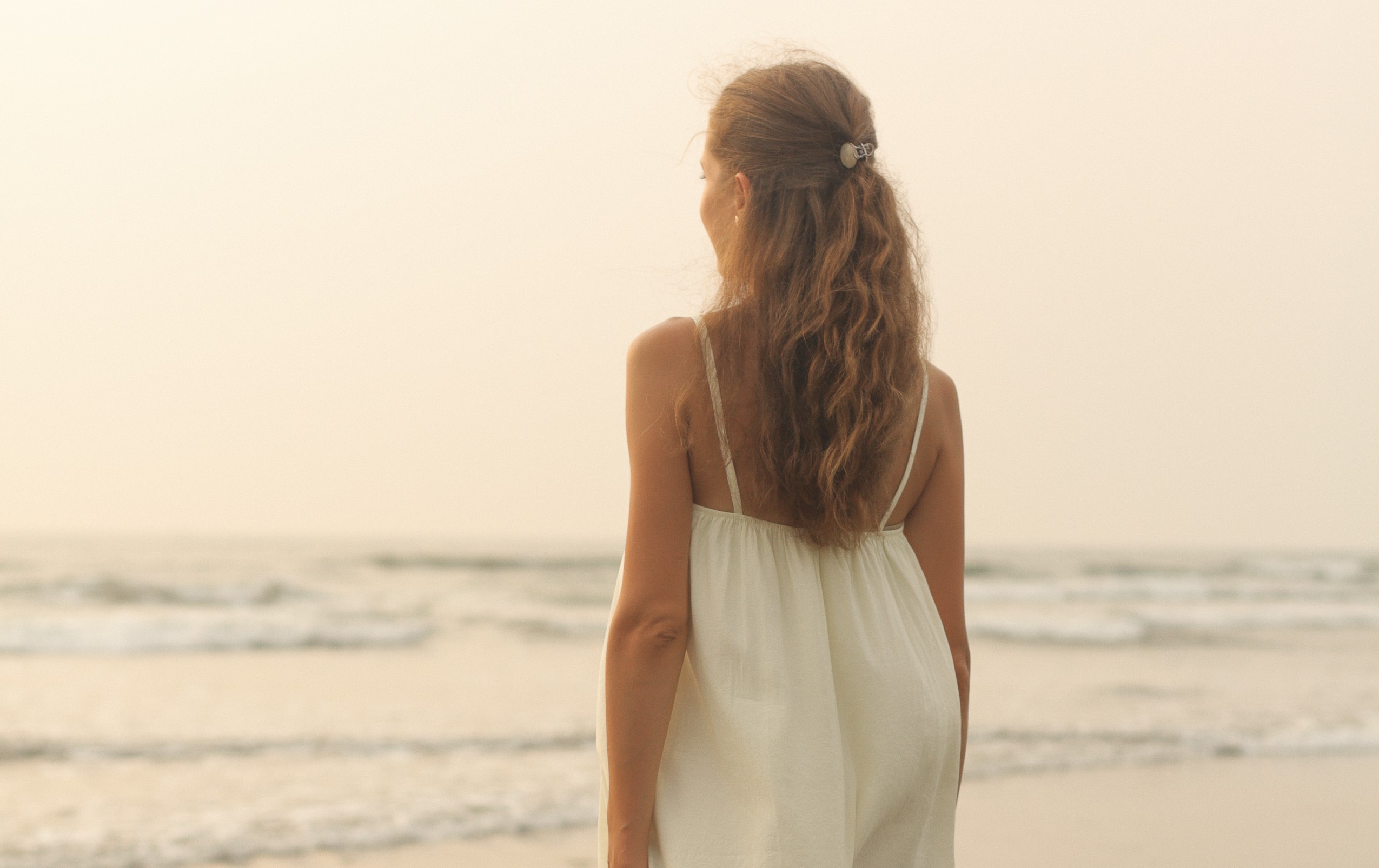 Full-body image of woman embracing inner peace.