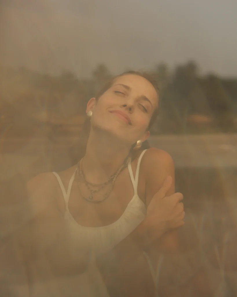 Woman outdoors embracing her inner power and serenity
